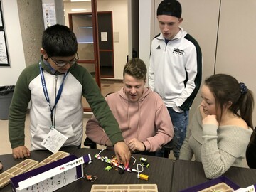 Abdullah Nasir (left), Grade 6 student teaching Lakeland College students.